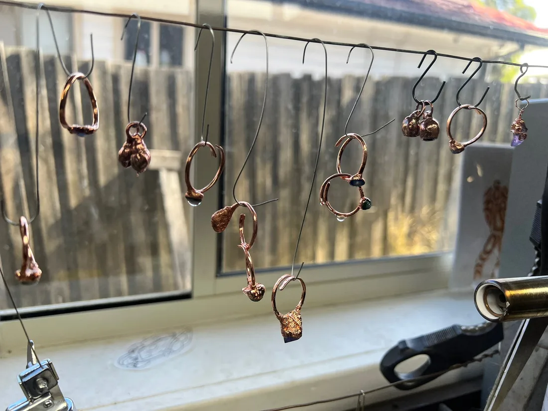 Jewellery making materials arranged on a work surface.
